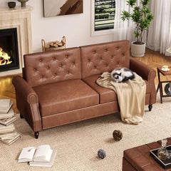Brown leather sofa in a living room with a fireplace and books.
