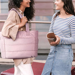 Pink quilted nylon tote bag, unisex gym and fitness carryall on white background