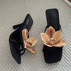 Black floral embellished square toe heeled mules