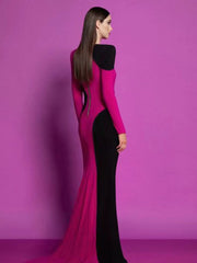 Woman wearing a pink and black evening gown against a purple background
