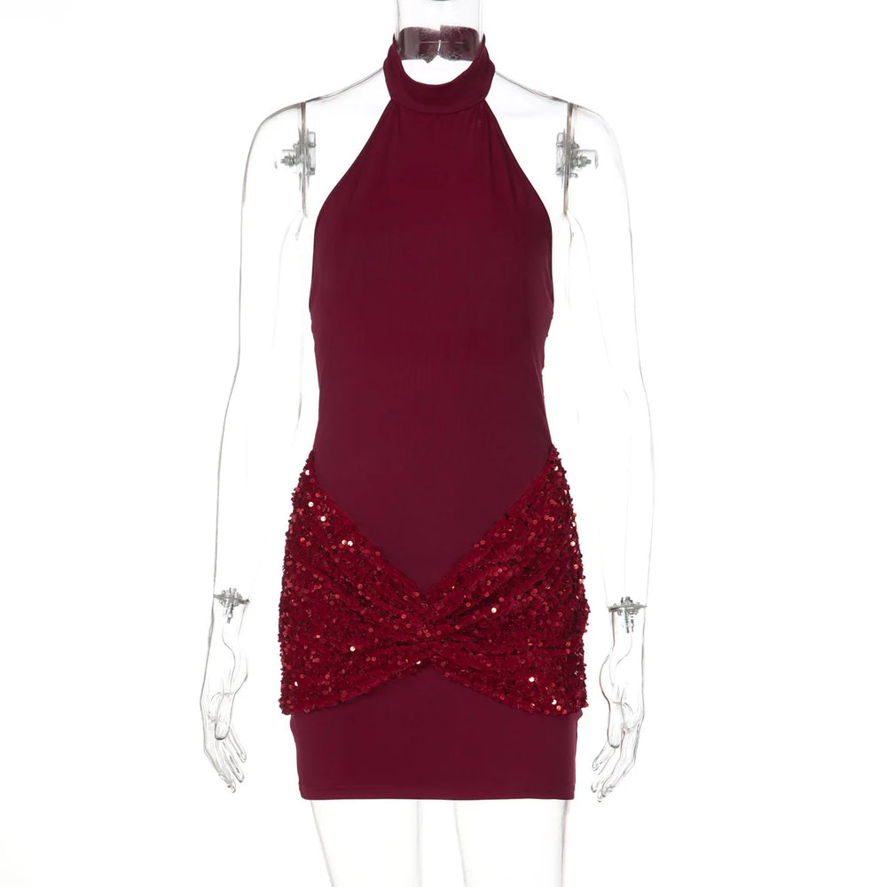Red halter neck dress with sequin detailing on a mannequin against a white background