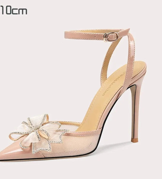 High-heeled shoe with floral design on a light background