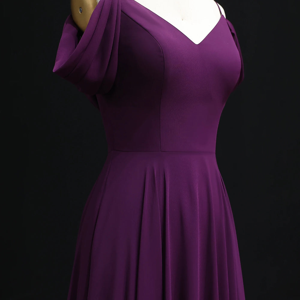 Purple dress on a mannequin against a black background