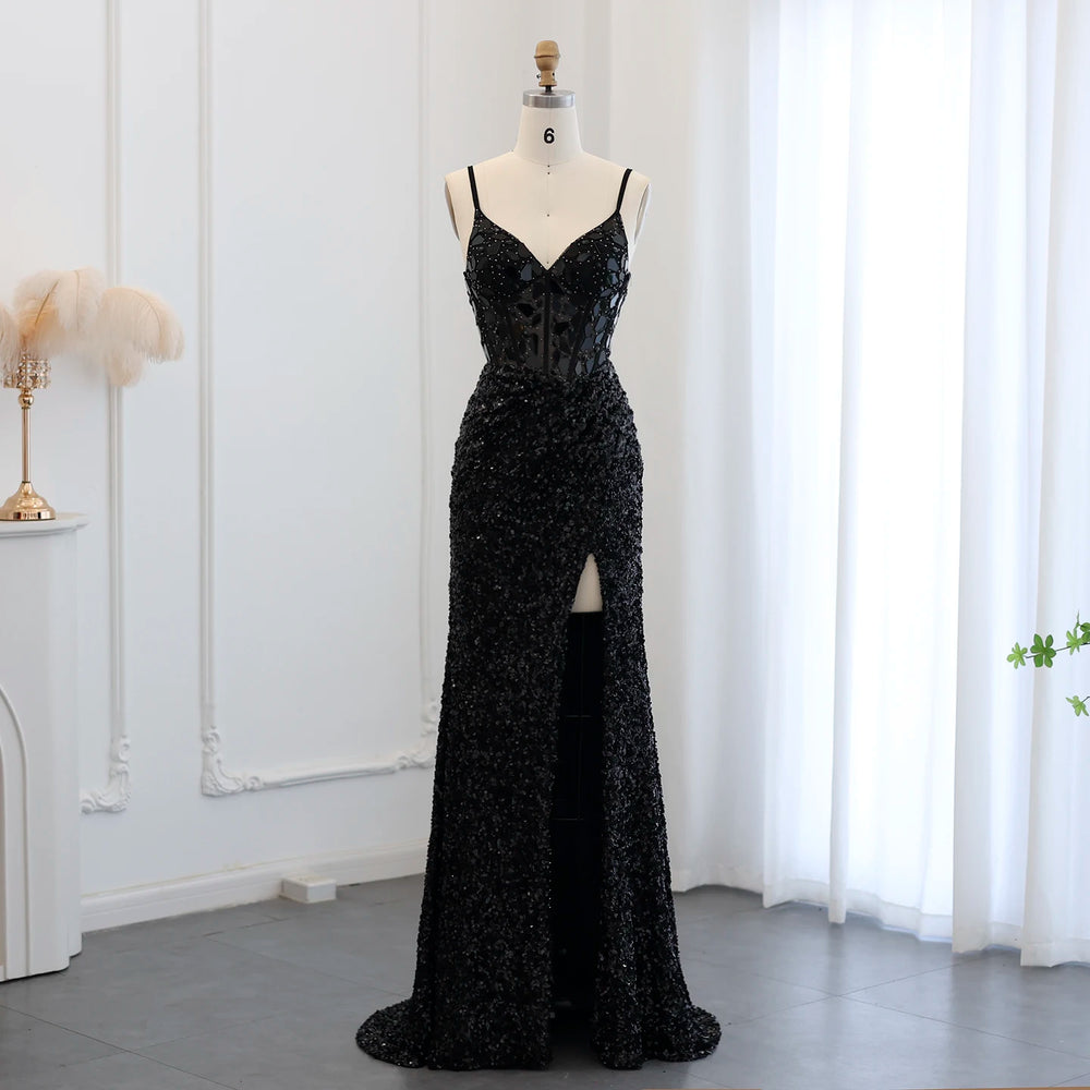 Black sequin evening gown on a mannequin against a white curtain background