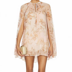 Beige floral print mini dress with cape sleeves and tie neck
