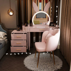 Pink vanity table with bunny ears mirror and chair in a bedroom setting