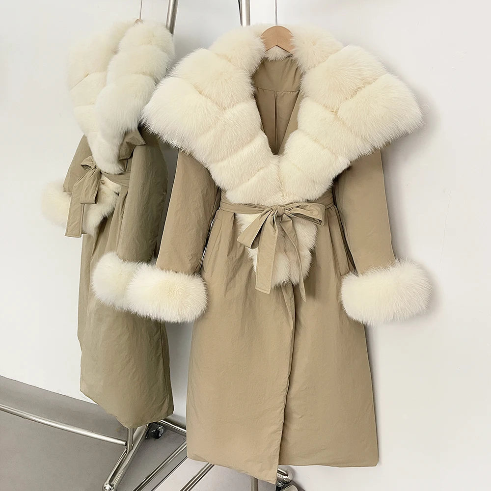 Beige coat with white fur trim on a rack 