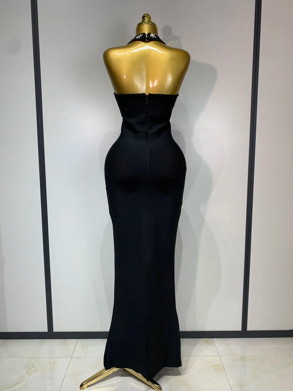 Halter neck sleeveless ankle-length knit bodycon gown with scattered diamond embellishments, back view showing zipper closure.