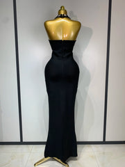 Halter neck sleeveless ankle-length knit bodycon gown with scattered diamond embellishments, back view showing zipper closure.