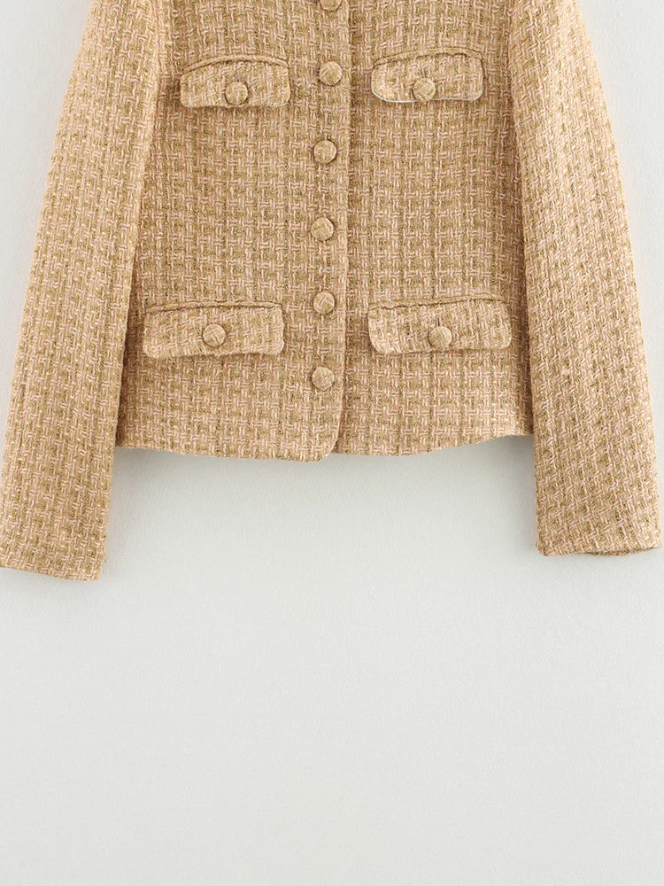 Beige tweed jacket on a light gray background