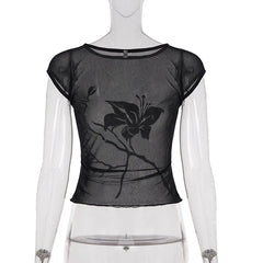 Black floral top on a mannequin against a white background