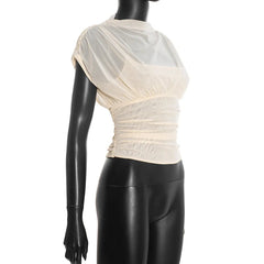 Mannequin wearing a cream-colored top with sheer sleeves on a white background