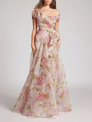 Floral one-shoulder evening gown on a white background