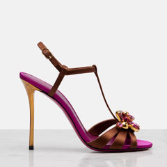 Side view of metallic heel stiletto sandal with floral embellishment
