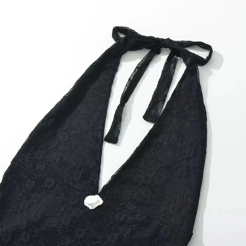 Black lace halter top on a white background