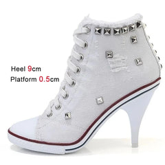  Close-up of white canvas boots with thin heels, highlighting the intricate cross strap details. 4