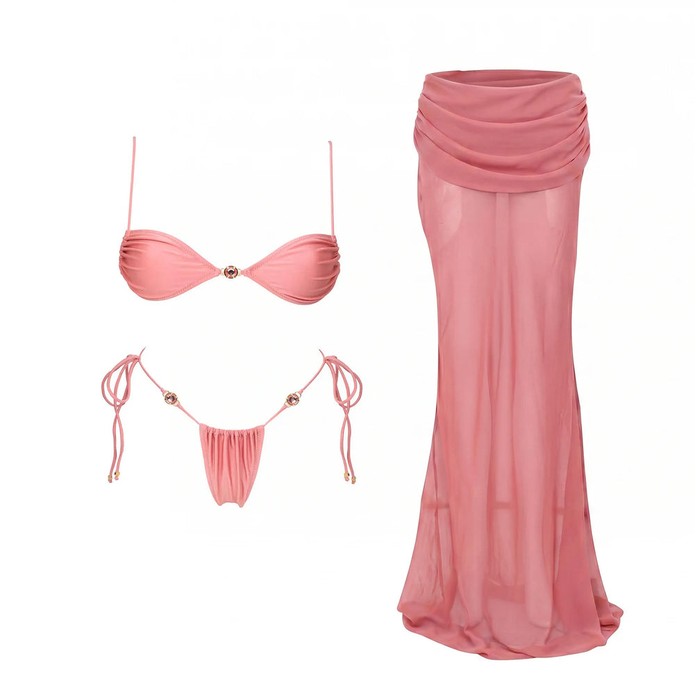Pink ribbed bikini top and bottoms with jeweled ties and a pink sheer draped maxi skirt