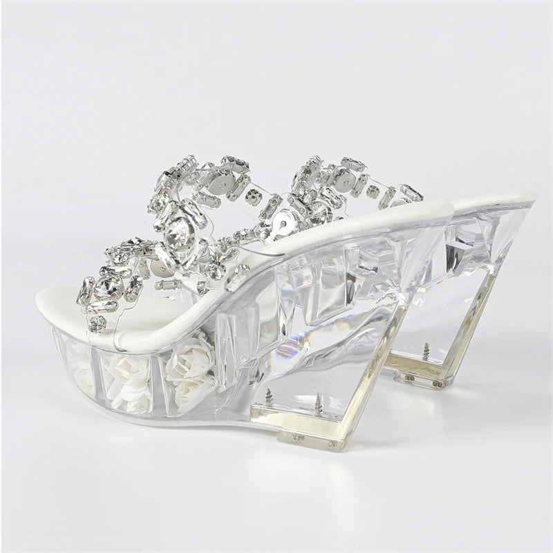 High-heeled shoe with crystal embellishments on a white background