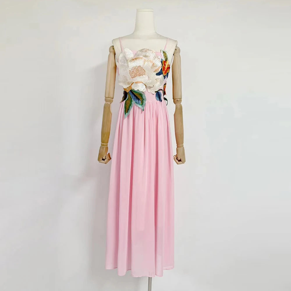 Mannequin wearing a floral top and pink skirt on a white background