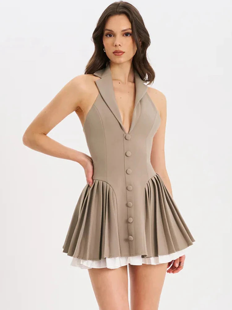 Woman wearing a beige dress with buttons on a white background