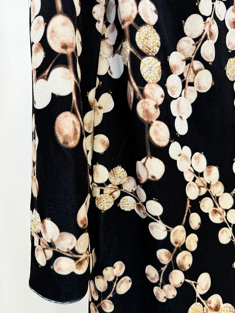 Close-up detail of the velvet fabric and berry print with beading