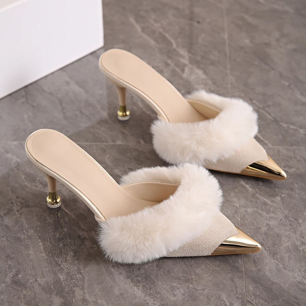 Cream faux fur trim pointed heel mules with metallic toe cap.