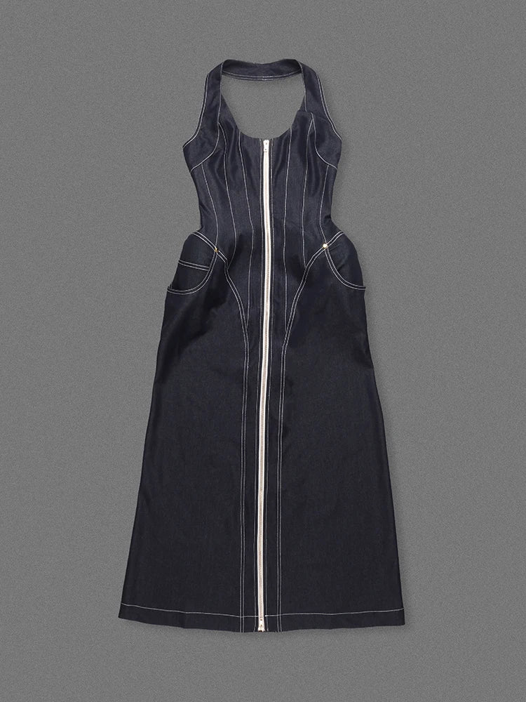 Black dress with a zipper on a gray background