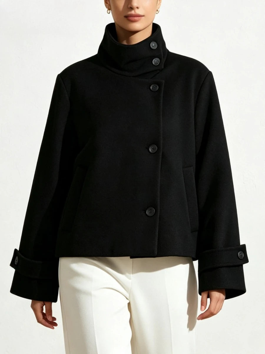 High neck solid cropped jacket with asymmetrical button closure and cuffed sleeves.