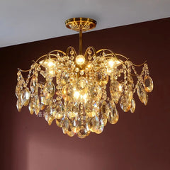 Gold chandelier with crystal elements on a dark background
