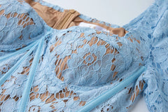 Close-up of a blue lace garment on a white background