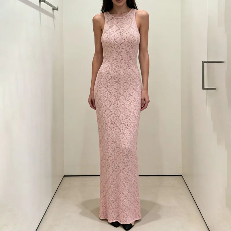 Woman wearing a pink lace dress in a minimalistic setting