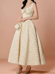 Cream scoop neck ankle dress with empire waist and floral appliqué detail