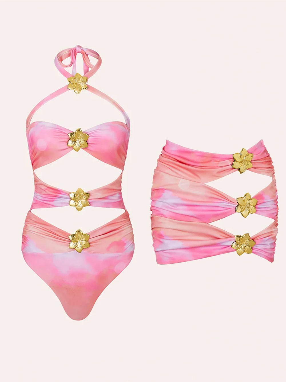 Pink and white tie-dye one-piece swimsuit with cutouts and gold flower accents, paired with a matching skirt.