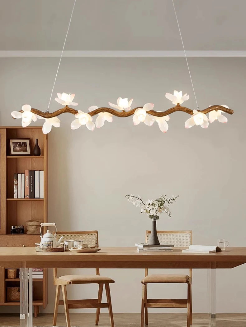 Modern dining room with a decorative ceiling light fixture.