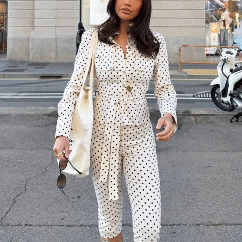 Woman wearing a polka dot button-up shirt and cropped pants set