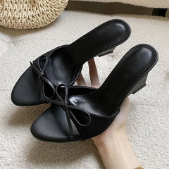 Black bow wedge mules