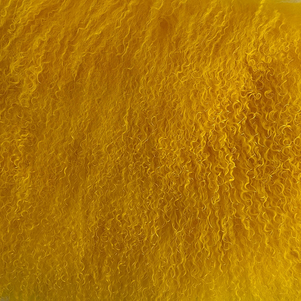 Close-up of a textured yellow surface