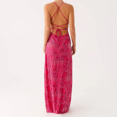 Pink patterned dress with open back on a white background
