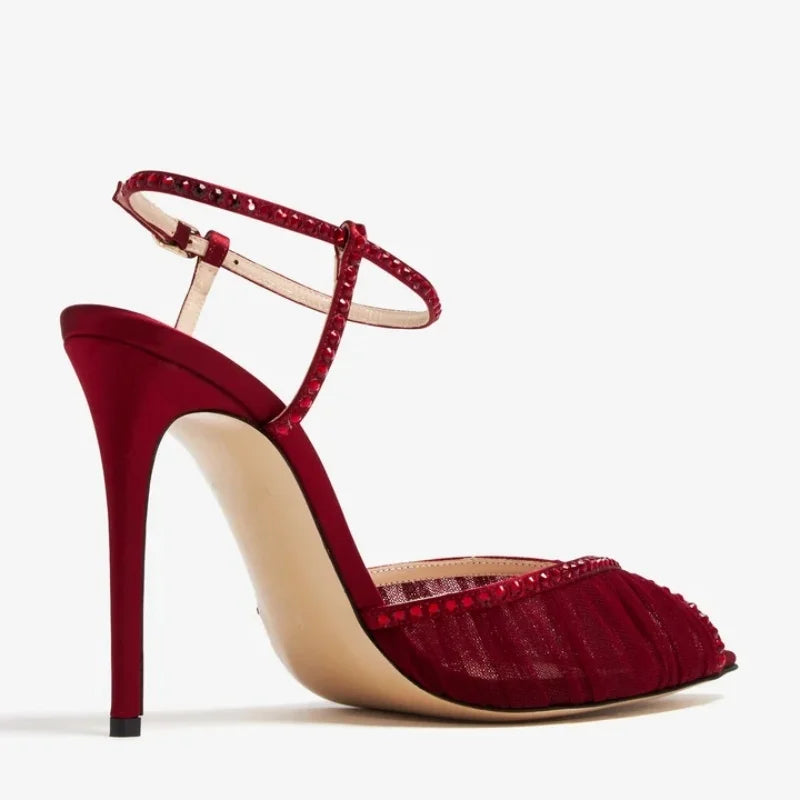 Sole view of a burgundy crystal mesh stiletto heel