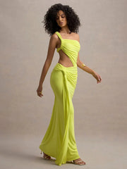 Woman wearing a bright yellow evening gown against a neutral background