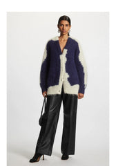 A woman wearing a comfortable blue fleece blend cardigan, perfect for fall and winter. Golden Atelier 2