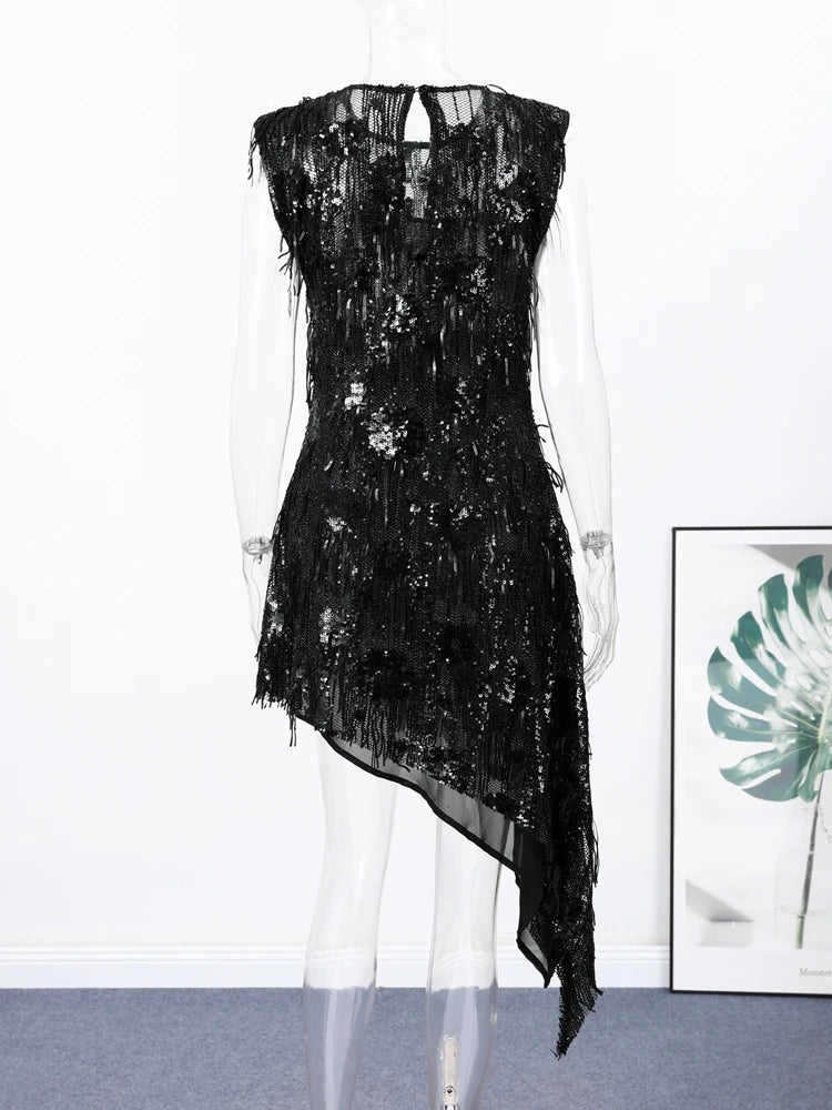Black sequin dress on a mannequin against a white background