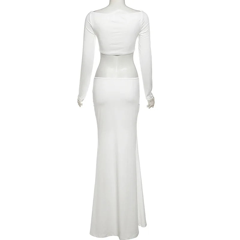 White long-sleeve gown on a mannequin against a white background
