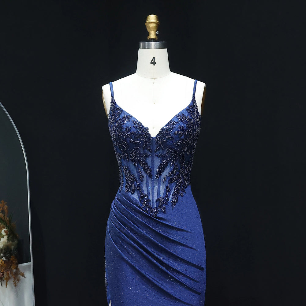 Blue evening gown on a mannequin against a black background