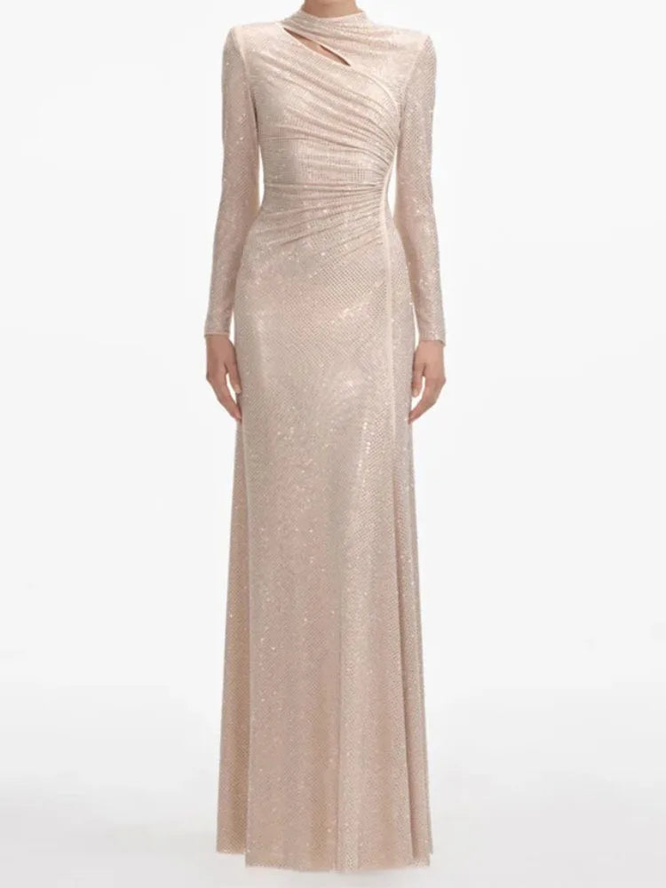 Apricot evening gown with long sleeves on a white background