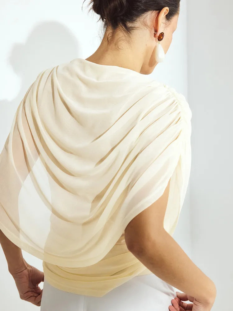 Draped mesh cape top in cream, back view