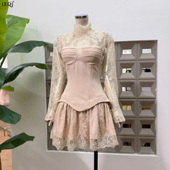 Apricot lace high neck mini dress with sheer long sleeves and structured bodice