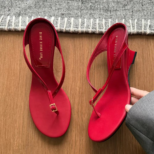 Red buckle strap wedge heel flip flops