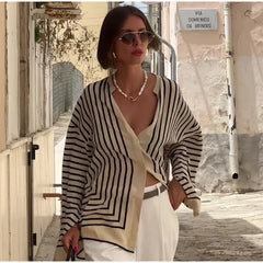 Women’s loose striped silk shirt with long flare sleeves and O-neck.