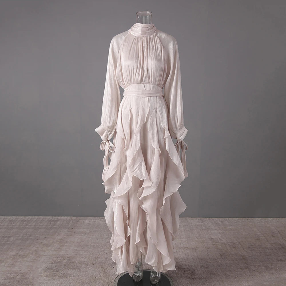 Apricot dress on a mannequin against a grey background